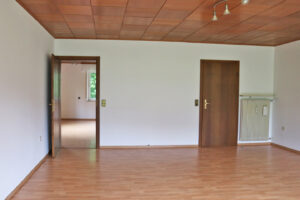 living room, view into kitchen